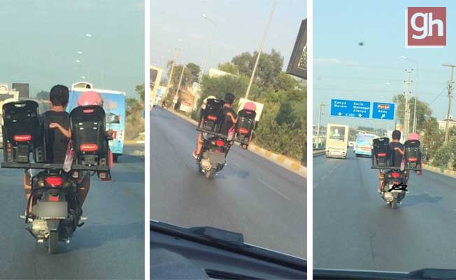 Motosiklet sürücüsü baba iki çocuğunu böyle taşıdı